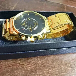 Men's black and gold tone watch